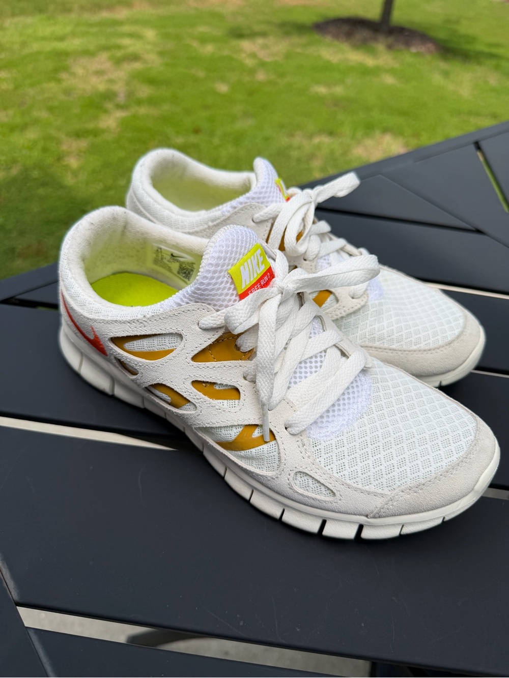 Nike White and Yellow Mesh Athletic Sneakers with Red Swoosh